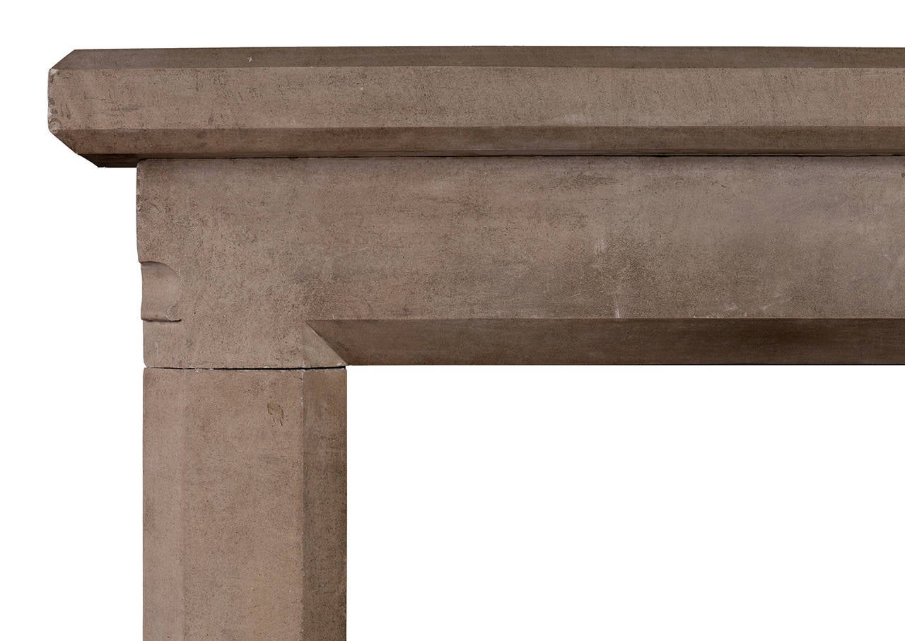 An English stone fireplace in the Gothic style. The frieze with moulding detail to ends surmounted by imposing shelf, early 20th century, possibly earlier.

Measures: 
Shelf Width:	1615 mm      	63 5/8 in
Overall Height:	1310 mm      	51 5/8