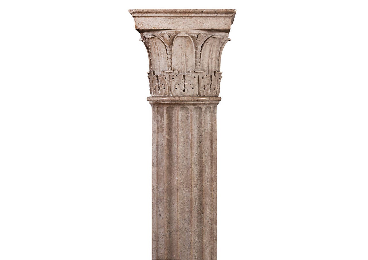 A collection of four neo-classical columns in Istrian stone. The moulded base surmounted by fluted shafts with finely carved Corinthian capitals to top. Very fine quality. (Width and depth are to widest point. Width of fluted column - 130mm / 5