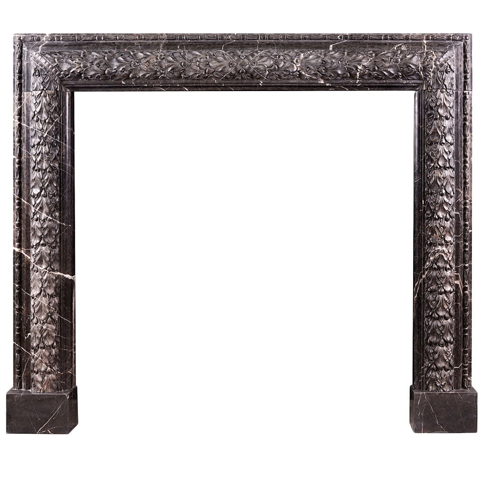 Elegant Carved Bolection Mantel in Nero Marquina Marble For Sale