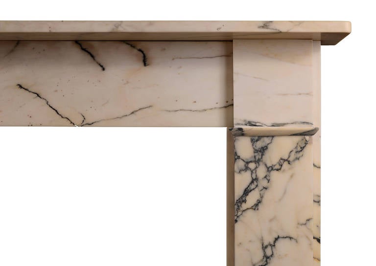 A simple yet elegant English fireplace in Italian Pavonazzo marble. 19th century.

Shelf Width - 1562 mm  |  61 ½ in
Overall Height - 1130 mm  |  44 ½ in
Opening Height - 933 mm  |  36 ¾ in
Opening Width	 - 1080 mm  |  42 ½ in
Depth of Shelf	-