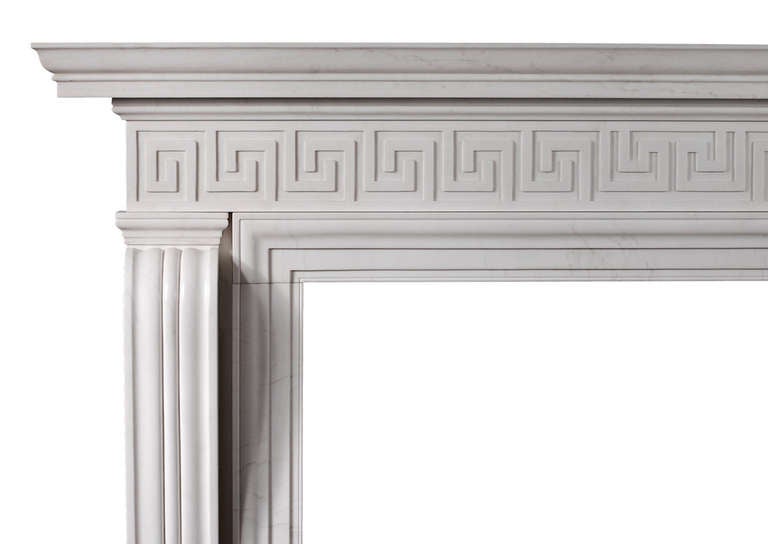 A good quality English Regency style fireplace in white marble. The moulded shaped jambs surmounted by Greek key pattern frieze and straight moulded shelf. After an early 19th century design.

Shelf Width:	        1805 mm /     	71 1/8 in
Overall