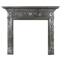 Antique A 19th century polished cast iron fireplace mantel in the Adam style