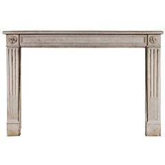 A 19th century French Louis XVI style stone fireplace mantel 3