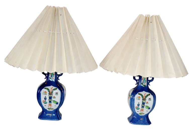 Pair of beautiful powder blue Chinese lamps, with fine line gilded motives, made from a pair of vases from circa 1790.