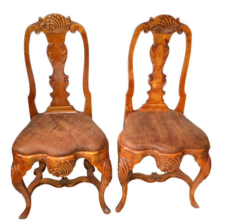 Very nice pair of Rococo chairs, newly upholstered in leather with a vintage look. Could be bought together with another pair of Rococo chairs in same color wood and leather, just a little different in the carving.