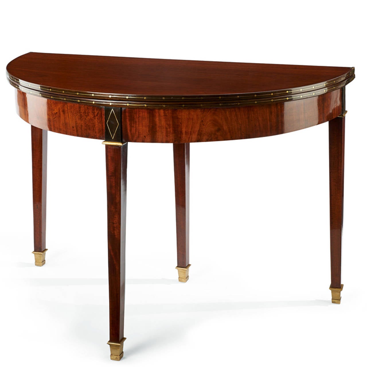 Exquisite french Demi Lune console, folding table, dating from 1815 -1820.
Elegant console table in a semi-circular shape with brass mounts, brass inserts among other in diamond shape and inside with felt layer.
Mahogany veneer.