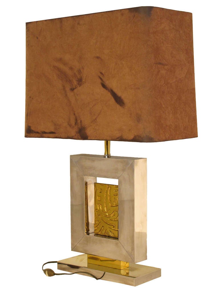 Elegant brass and chrome table lamp by Maison Bagues from the 1970's with rectangular shade.