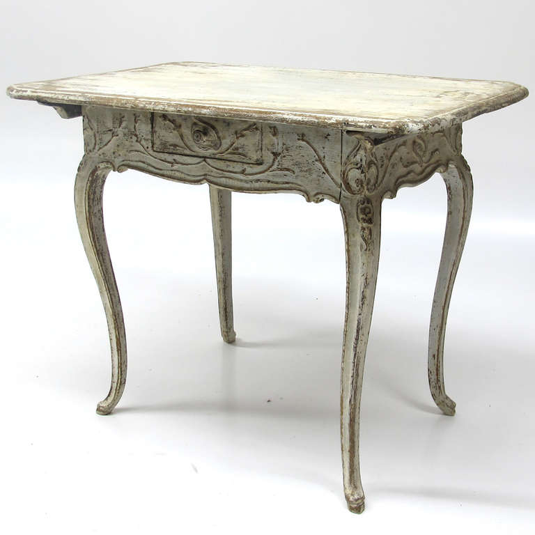 Beautifull carved and painted North German Baroque table with one small drawer dating from 1750-1770.