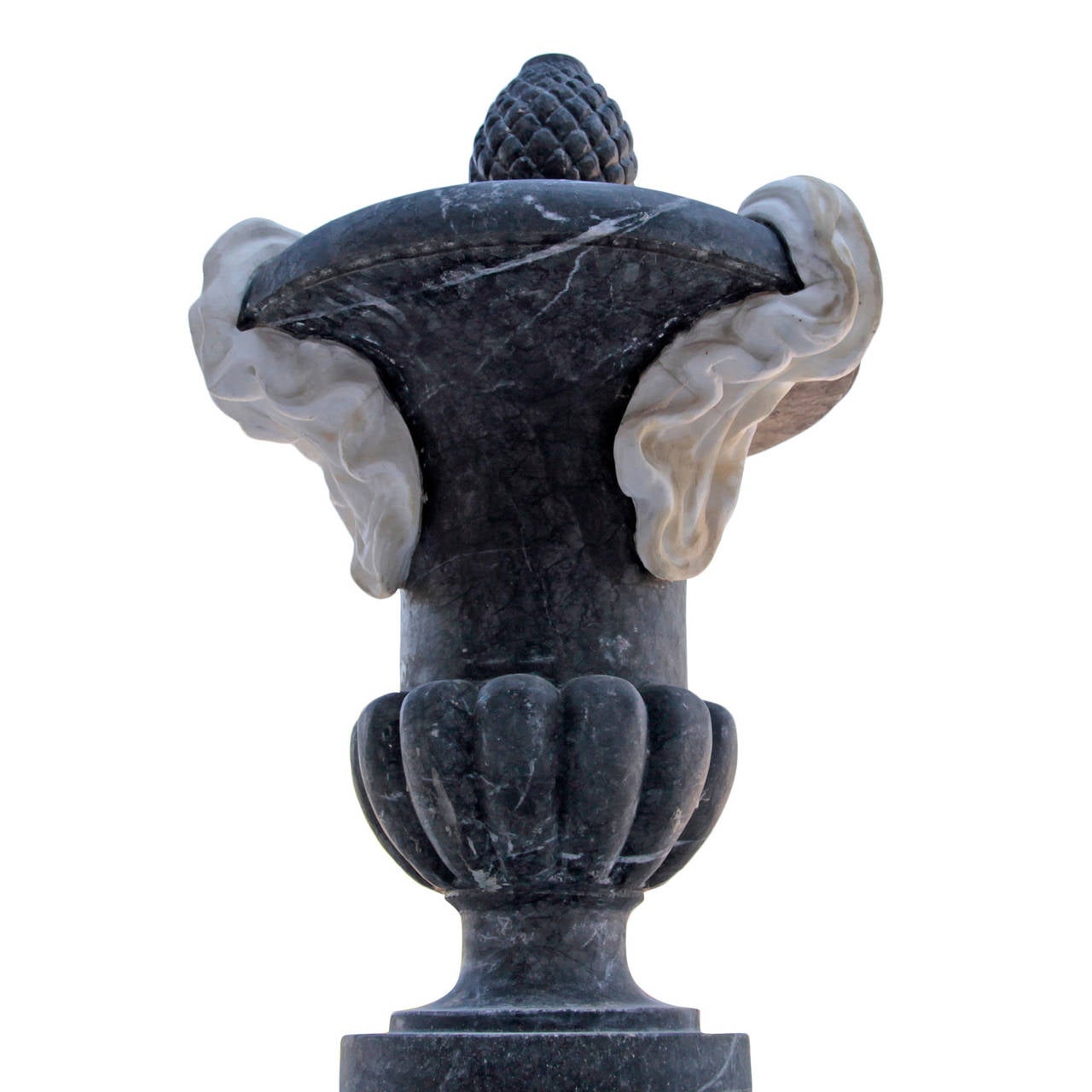 Magnificent Italian Marble Fountain from the 20th Century.
It is carved out of white and black marble and probably from Italy, early 20th century. The fountain stands on a high, trefoil cut base and has a narrow shaft surrounded by three dolphins.