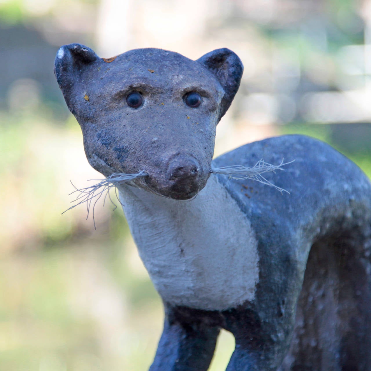 Mid-Century Modern Cast Stone Weasel Sculpture by Kiefer, from the 1950s.