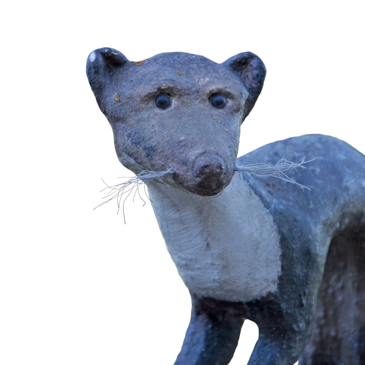 Naturalistic Cast Stone Weasel Sculpture by Kiefer, from the 1950s. It sits on a base and looks slightly to the left, his long back is bent characteristically. The eyes are out of glass, the whiskers are nylon.