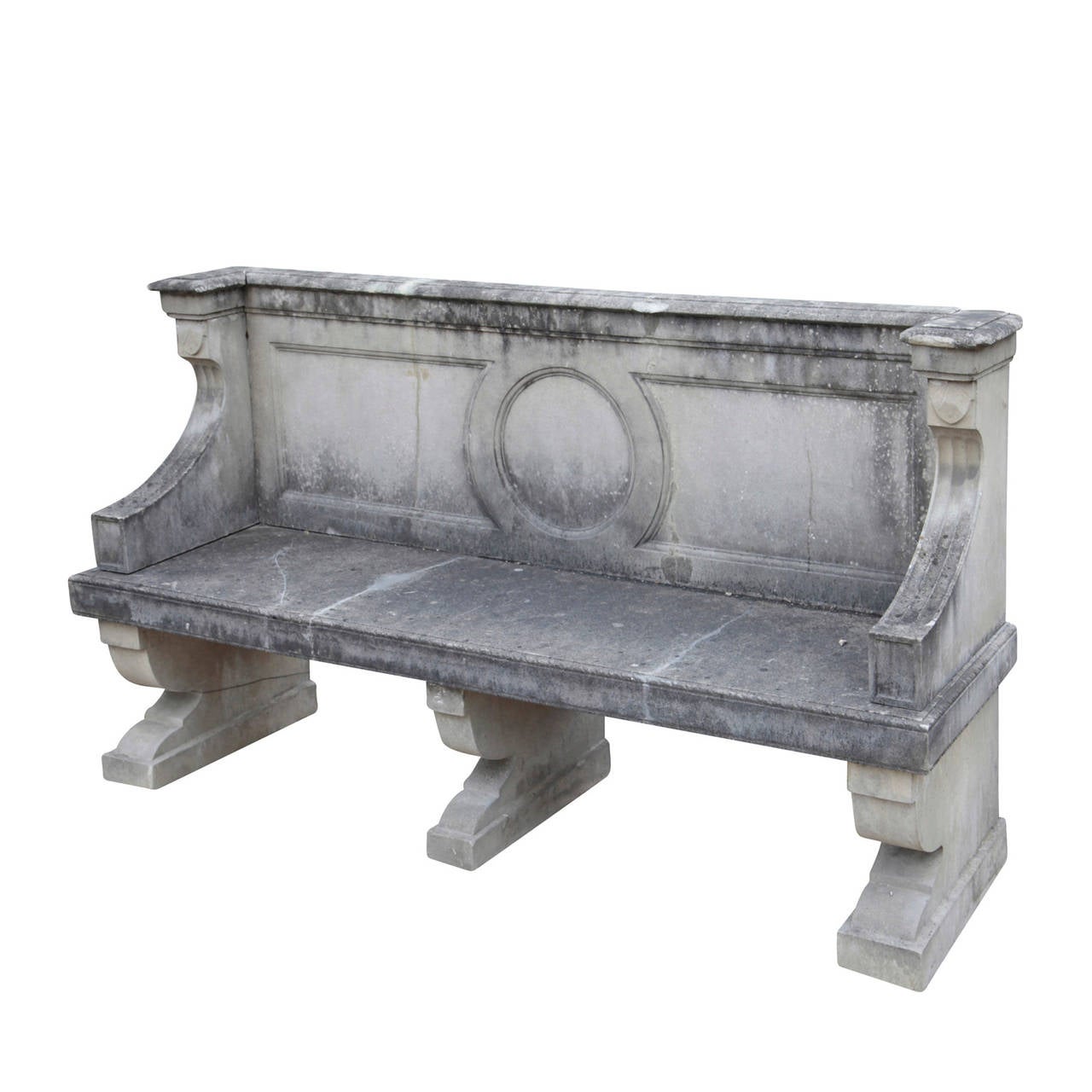 Elegant English Stone cast Park Bench from the 20th Century.
The bench is worked in the clear lines of the Neo-Classicism. It stands on three massive skids-like pedestals and has a smooth rectangular seat. Concave curved armrests are setback a