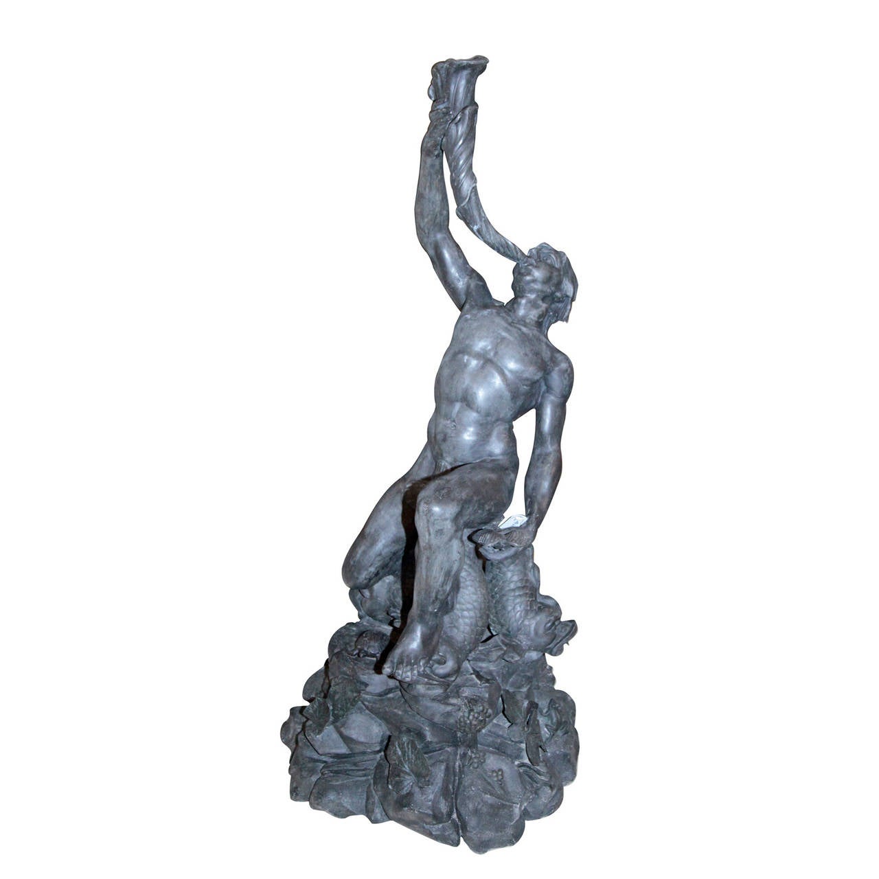 Imposant zinc Alloy Gargoyle, depiction of Triton from the mid-19th century.
Sculptural depiction of Triton, blowing a snail shell, carried by three dolphins.
In style of the depictions of the 16th and 17th century.