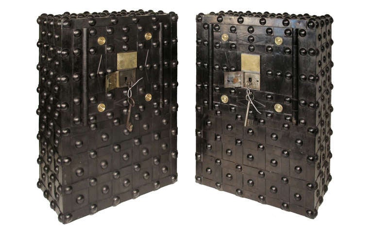 A magnificent pair of french Charles X hobnail safes dating from circa 1810. These safes are beautifully made from a thick wooden carcas lined inside and out with sheet steel with steel bands fixed with massive hobnail rivets creating a highly