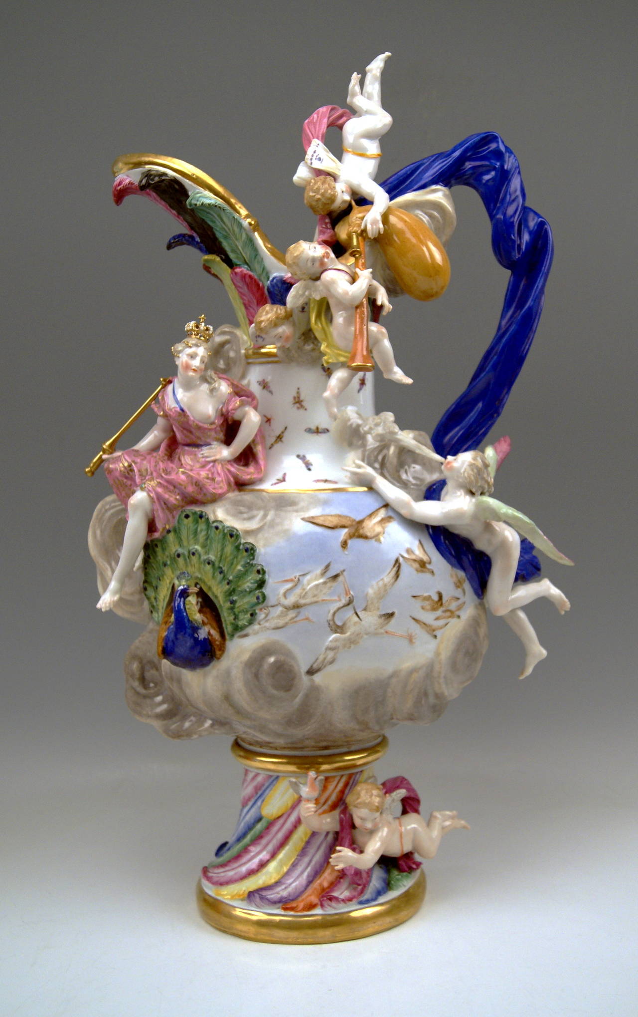 Meissen gorgeous as well as huge ewer: 
It derives from a series of  FOUR ELEMENTS  -  this ewer symbolizes AIR.
Dating: made 19th century (circa 1850).
Material: White porcelain, glossy finish, finest painting. 
Technique: Handmade