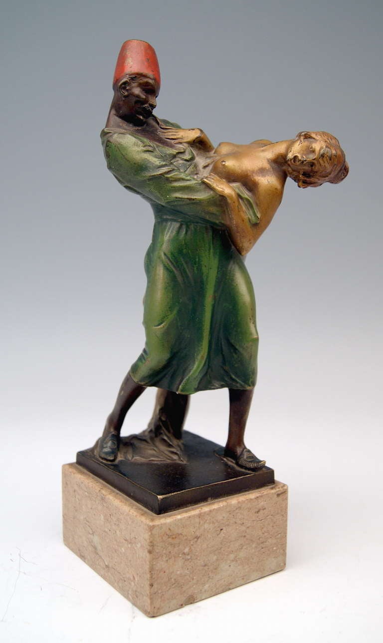 A finest Viennese Art Nouveau tall Bronze / Arab man designed by famous modeller Bruno Zach (1891 - 1935): The Arab slave trader is going to kidnap a bare-breasted woman who defends against mugging with all her strength. The figurine group is