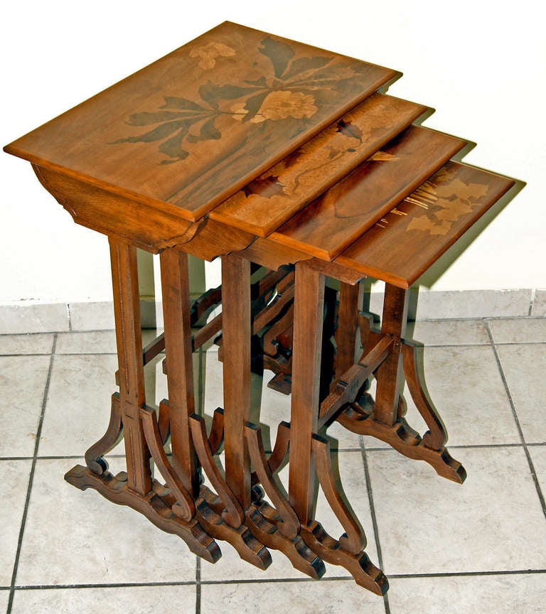 Emile Gallé  /  Set of Nesting Tables  (signed)
Nancy  (France),  designed  circa  1900
made by  Emile Gallé  (Nancy), circa 1900/05
height of largest table:  28  inches
mahogany wood, decorated with various precious woods   (inlay