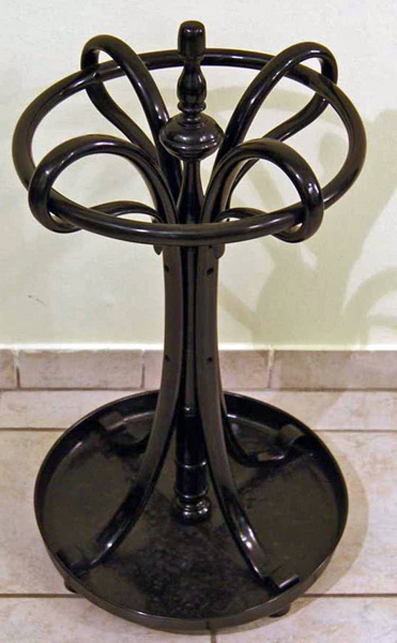Thonet round support for umbrellas (umbrella stand)  / number 1

beech wood ,  black stained  /  high quality handwork 
This nicest accessory for antechamber is stunningly shaped, indeed  (the wooden parts are amazingly bent in finest Thonet