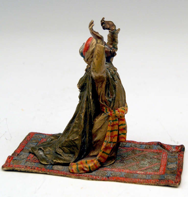 Gorgeous Vienna Bronze figurine made by famous manufactory Bergman(n) around Turn of Century (circa 1900). The Arab wearing the characteristic turban as well as a mantle falling down man's back kneels on carpet with raised hands: The Arab is