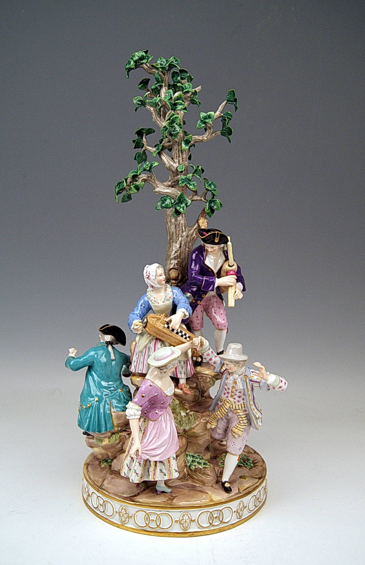 Meissen gorgeous & huge group of Gardener Figurines making music  (GARDENER MUSICIANS) assembled around a tree 

height:  49 cm  ( = circa 19.6 inches ) 
diameter of base:  22 cm   ( = circa 8.8  inches )

Manufactory: Meissen
Hallmarked: 