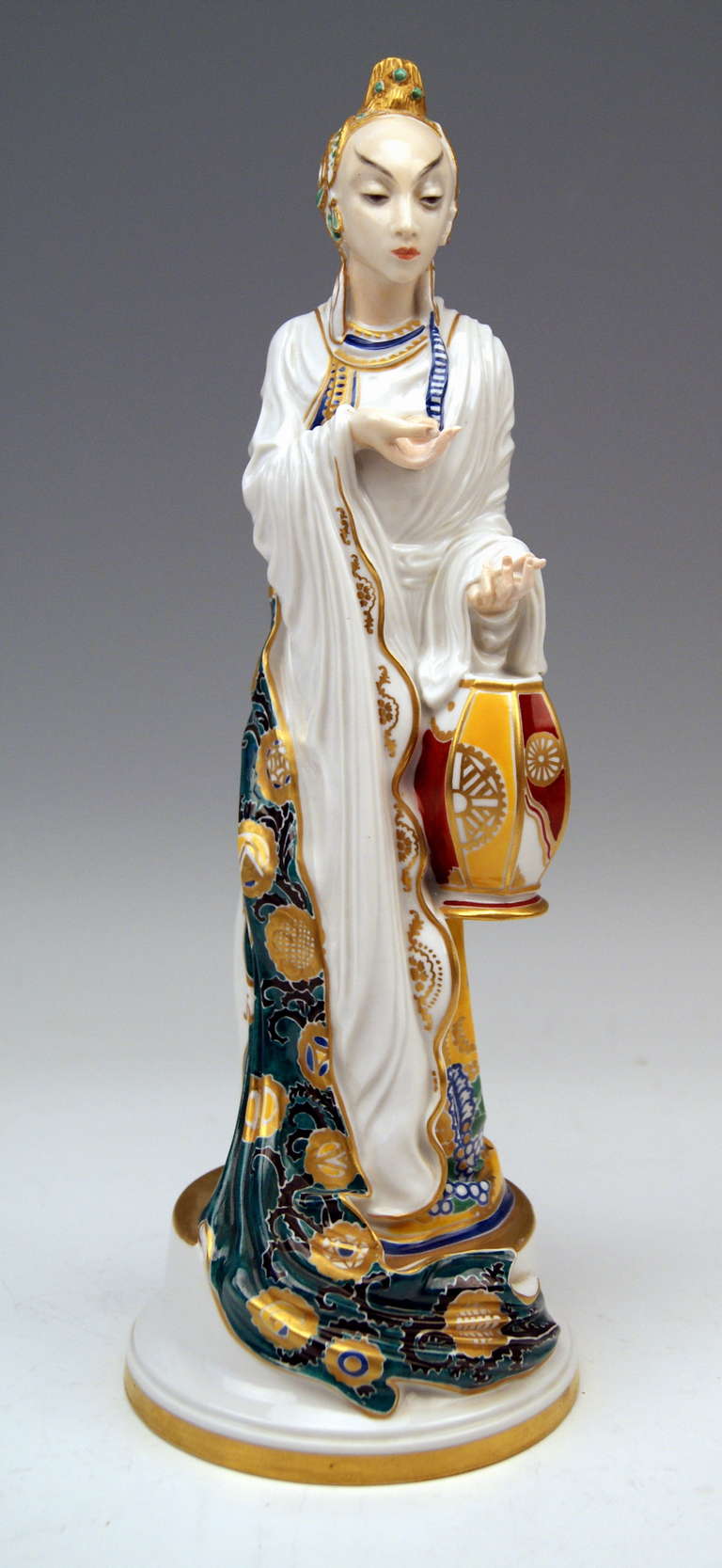 ROSENTHAL RAREST FIGURINE OF A CHINESE LADY
THE ORIGINAL GERMAN TITLE IS:   TÄNZERIN TSCHAOKIUM   ( = LADY DANCER CHAOKIUM )
The Chinese woman wearing a long dress covered with mantle holds a Chinese lantern in left hand. The woman's garments are