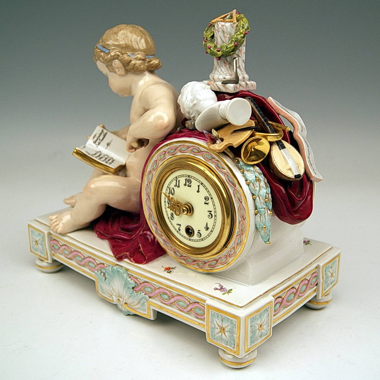 Meissen Gorgeous Mantle Table Clock with Cherub 
 
Manufactory: Meissen
Hallmarked:  Blue Meissen Sword Mark with Pommels on Hilts  (underglazed)
MODEL NUMBER  D 78   /   FORMER'S NUMBER  163-88  /  PAINTER'S NUMBER  17
FIRST QUALITY  
Dating: