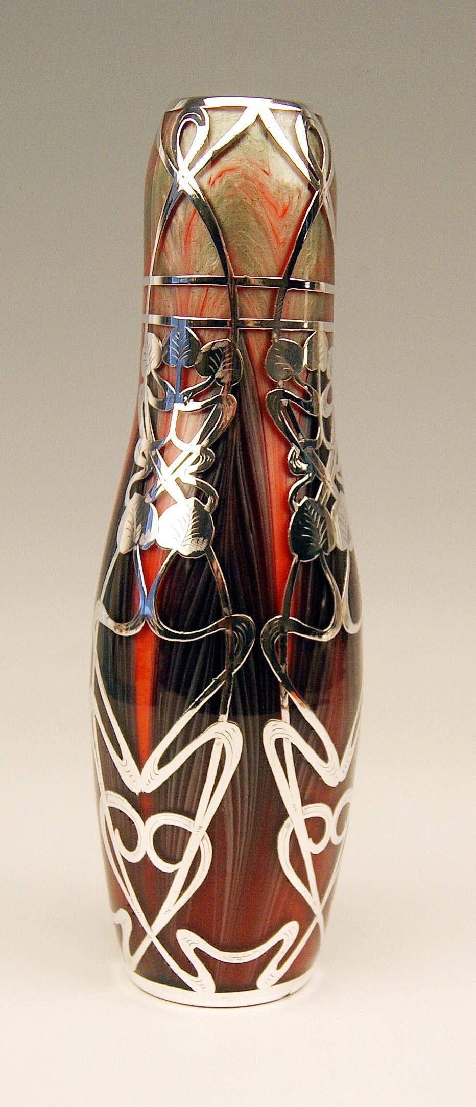 Vase Loetz Widow Klostermuehle Bohemia Art Nouveau 

Made by Loetz, Klostermühle   circa  1906
Decor:   TITANIA GRE 2512 &  Finest Silver Overlay

This gorgeous Loetz Art Nouveau Vase is of bellied as well as of oblong form type. The round mouth