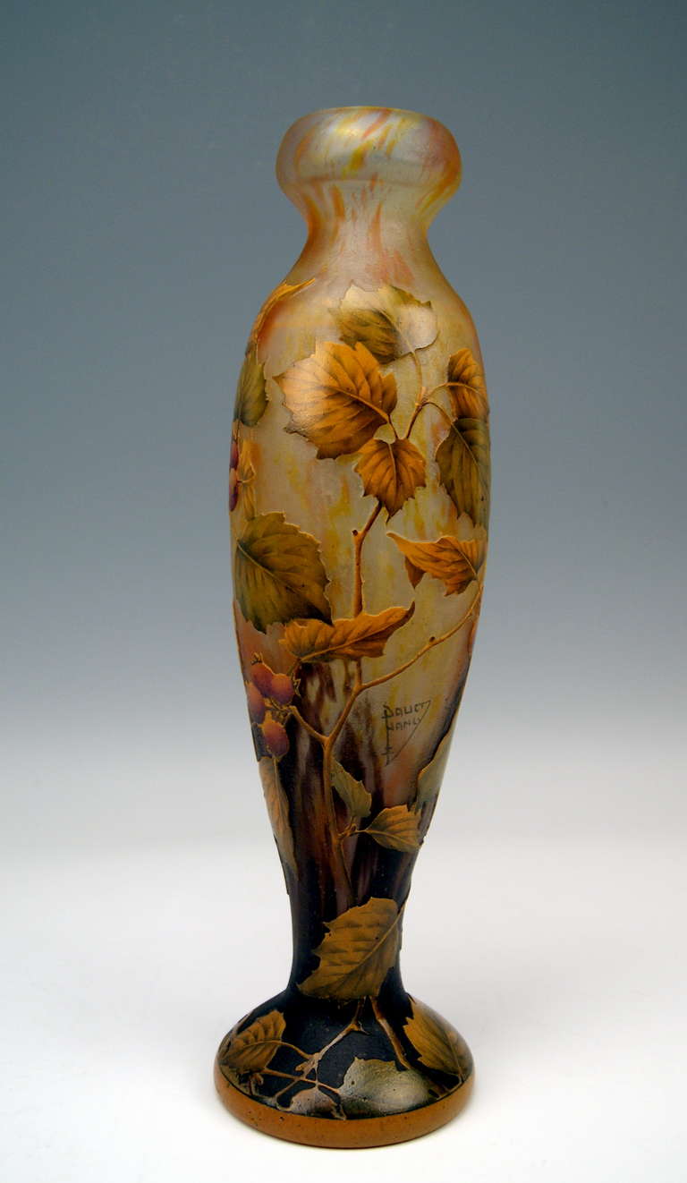 Daum Nancy Art Nouveau Vase made in France / Lorraine, circa 1900 - 05. 
Stunningly manufactured casing milky glass with orange-yellow-reddish-brownish powder meltings.  The bellied oblong vase is of tapering type   /   round mouth  &  almost plane