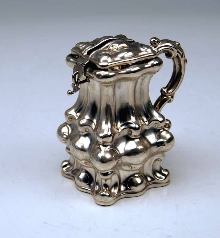 AUSTRIAN SILVER MONEY BOX  /   PIGGY BANK
 Biedermeier Late Period  /  dated 1856

 EXCELLENTLY MADE LIDDED MONEY BOX STANDING ON SQUARE  PLANE BOTTOM. THE SURFACE IS ACCENTUATED BY MANY BULGED AREAS.  THE UPPER PART OF BOX IS OF TAPERING TYPE.