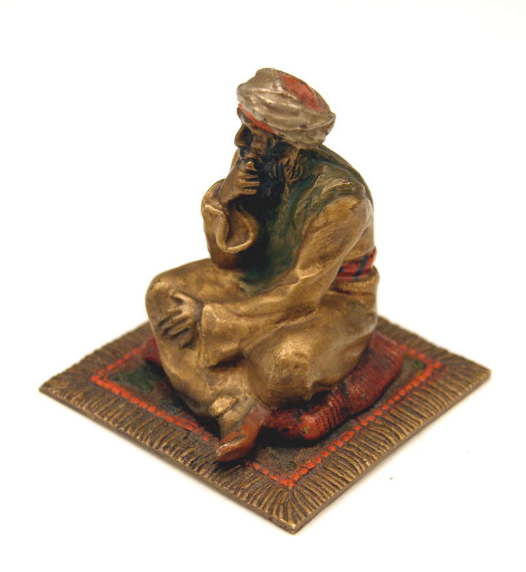 Gorgeous Vienna Bronze figurine made by famous manufactory Bergman(n)  circa 1890-1900. 
 The Arab  - being in a reflective mood  -  wears the characteristic turban as well as long Arab dress  /  he sits on a cushion having been put on carpet.

