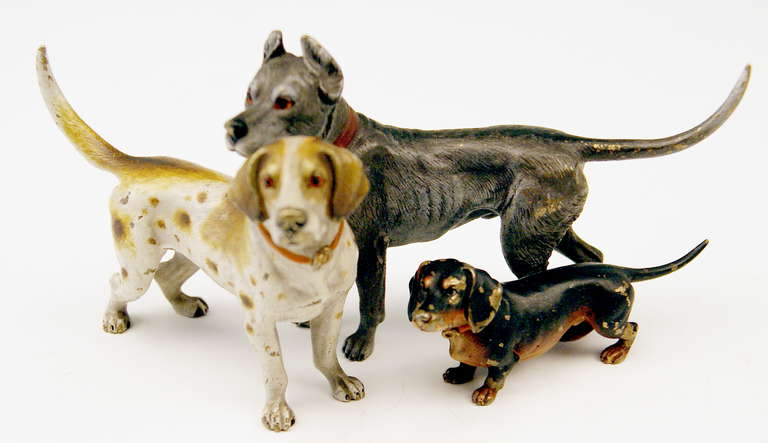 Gorgeous Vienna Bronze figurine group of animals made by famous manufactory Bergman(n)  circa 1890 - 1900. 
It is a lifelike group of three dogs  (dachshund  |  doberman  |  pointer dog)  connected to each other.  -  Signature B (BERGMAN(N)'S FIRM