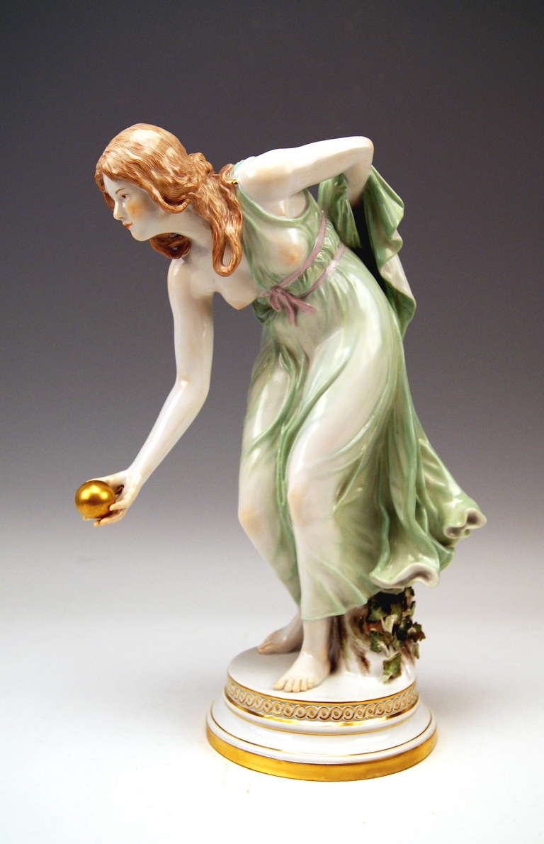 Meissen Aart Nouveau tall girl playing bowls figurine created by Walter Chott. Made during Pfeiffer period 1924-1934. First quality.
Meissen blue sword mark with pommels on hilts  (underglazed)
Model number: q 180. Painter's number: 30. Former's