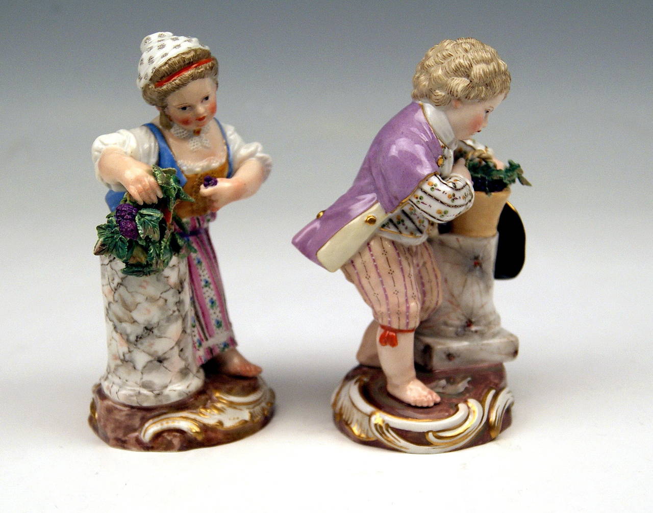 Meissen Lovely Pair of Children Season's Rococo Figurines - The Fall:
Girl and Boy with Wine Grapes, both supporting themselves on marble column
   
MANUFACTORY:  MEISSEN

DATING:   19th century / made  circa 1870
MATERIAL:  WHITE PORCELAIN, GLOSSY
