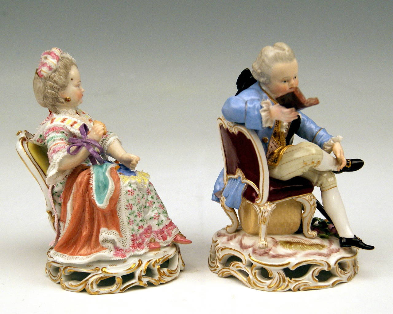 Meissen Lovely Pair of Child Figurines:
Girl Dressed as Elegant Rococo Lady, seizing a shell in right hand  &  Boy Reading a Book  
   
MANUFACTORY:  MEISSEN

DATING:   19th century / made  circa 1850 - 60

MATERIAL:  WHITE PORCELAIN, GLOSSY