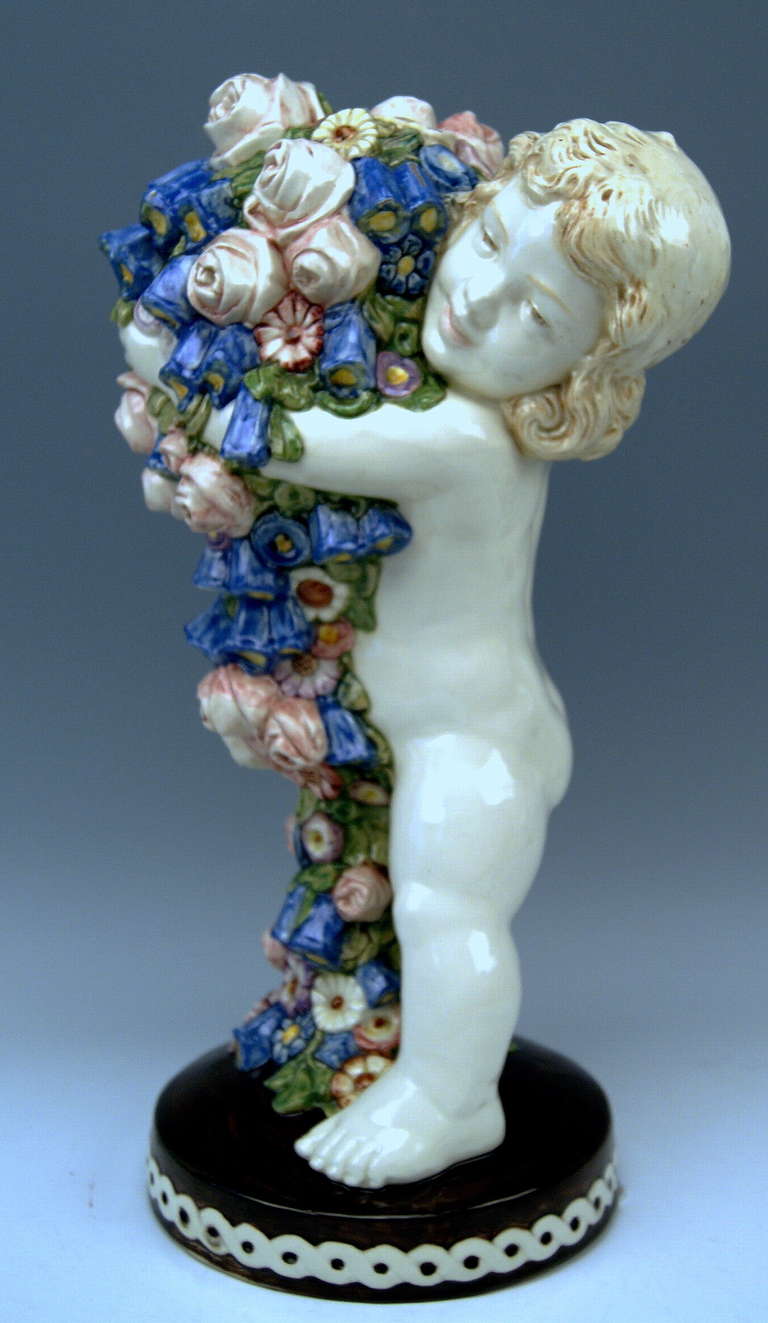 DESIGNED BY CARL KLIMT   (1876 - 1945)       MADE CIRCA 1915.  
MATERIAL:  EARTHENWARE  (WHITE  MATERIAL)
MODEL NUMBER    9389  /  10  /  45
MADE BY: Bernhard Bloch, Eichwald  (Bohemia)  

SUBJECT:
MOST LOVELY NAKED CHERUB FIGURINE SEIZING A