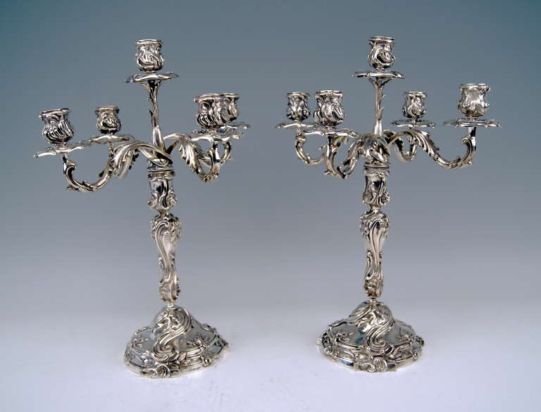 Gorgeous German Silver Pair of Tall Candlesticks of finest manufacturing quality.  
They are stunningly decorated - made in following manner:
VICTORIAN STYLE      Surface of   BOTH CANDLESTICKS  is abundantly ornamented with chasing  / chiselled