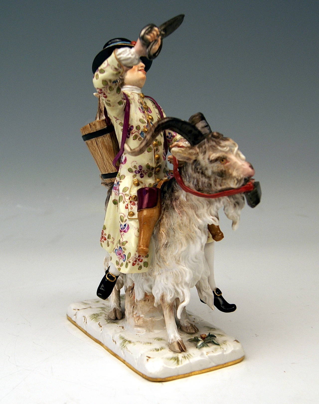Meissen Gorgeous Figurine Group created by Johann Joachim Kändler 
(1706 - 1775)  around the year 1740:  so-said  ‘Tailor Of Count Bruehl Riding on Goat.'

Presumptive Background:
Heinrich, Count von Bruehl   (1700 - 1763)   was Chief Minister