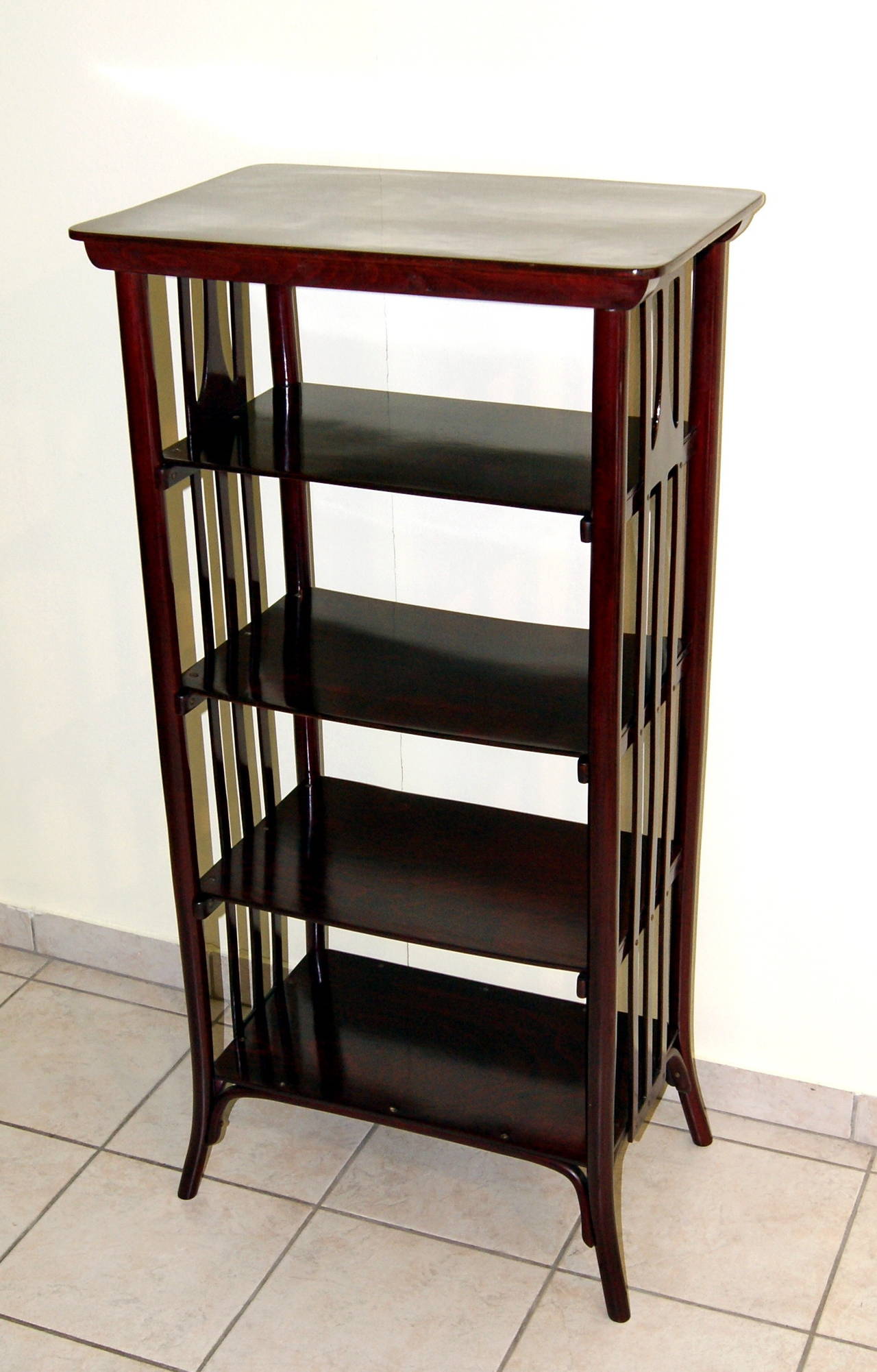 Thonet Art Nouveau Vienna Etagère or Bookshelf
made  circa 1905  - 1910

beech wood and dark mahogany stained
refurbished by hand

Most elegant etagère having four shelves where books or objects/articles of virtue can be put on: This model