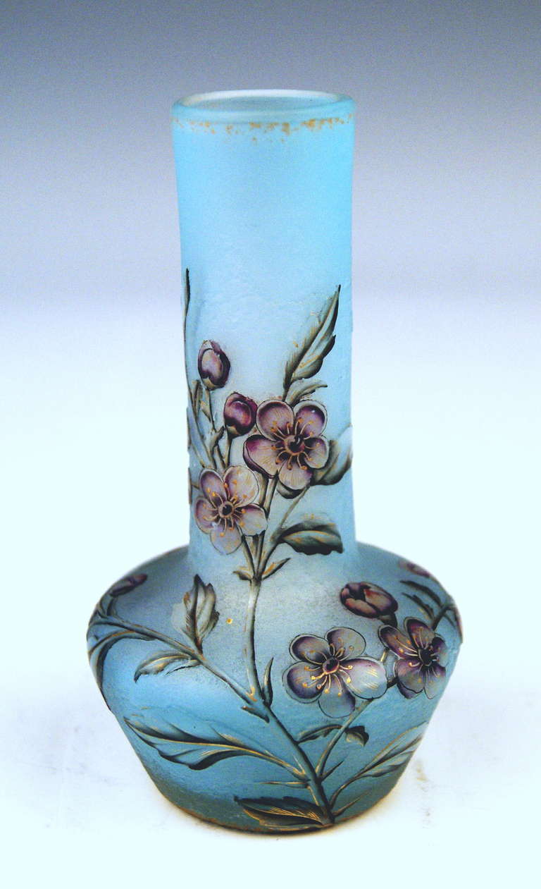 Daum Nancy Art Nouveau Vase made in France / Lorraine, circa 1900. 
 Stunningly manufactured casing glass:  With bright bluish glass layers underneath. Additionally, there are finest decorations on surface visible - flower's blossoms attached to