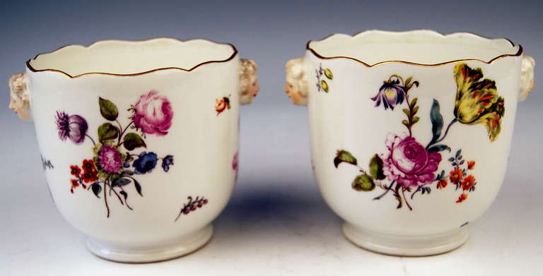 Meissen gorgeous pair of cachepots / planters stunningly decorated with flower blossoms, made in Rococo Period / circa 1750. 
 The white porcelain surface is ornamented with finest bundle of scattered flowers, depicting for example: rose flowers'