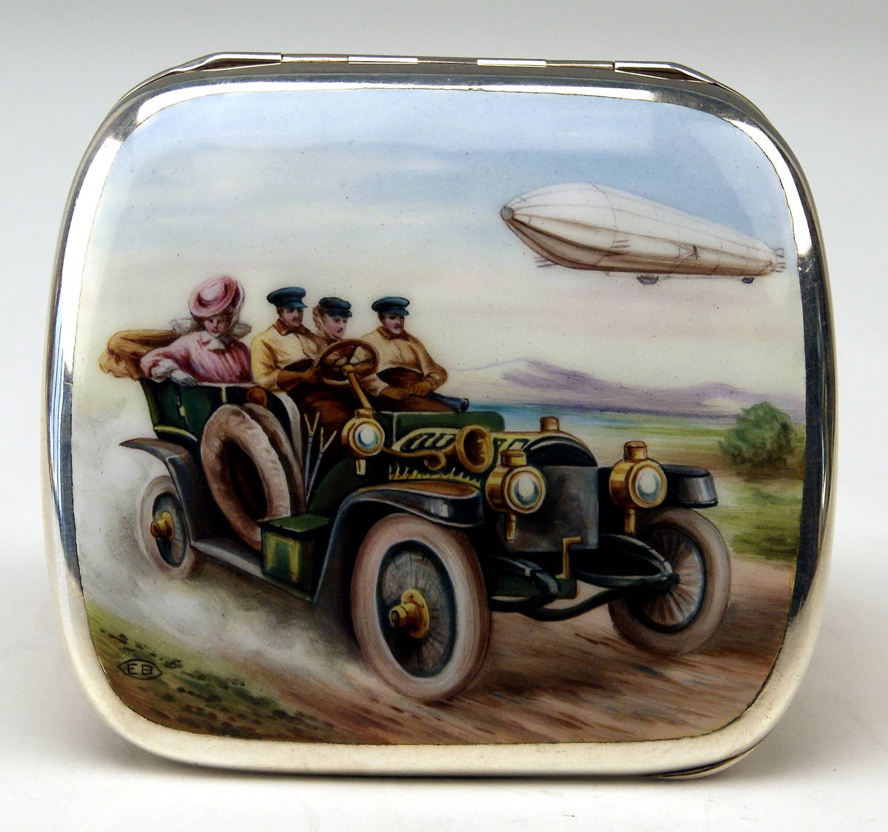 German gorgeous silver cigarette lidded box (gilded inside)

the lid is decorated with stunning enamel painting - following scene is visible there: two elegant ladies being situated in vintage car driven by man /  a second man sits beside him. the