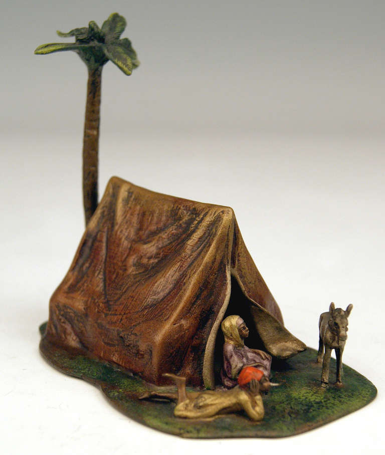 Gorgeous Vienna bronze figurine group made by famous manufactory Bergman(n), circa 1920. 
There is an Arab couple (= nomads) being situated in front of a tent (the man is lying prone and the woman sits cross-legged) and  a donkey is watching them.