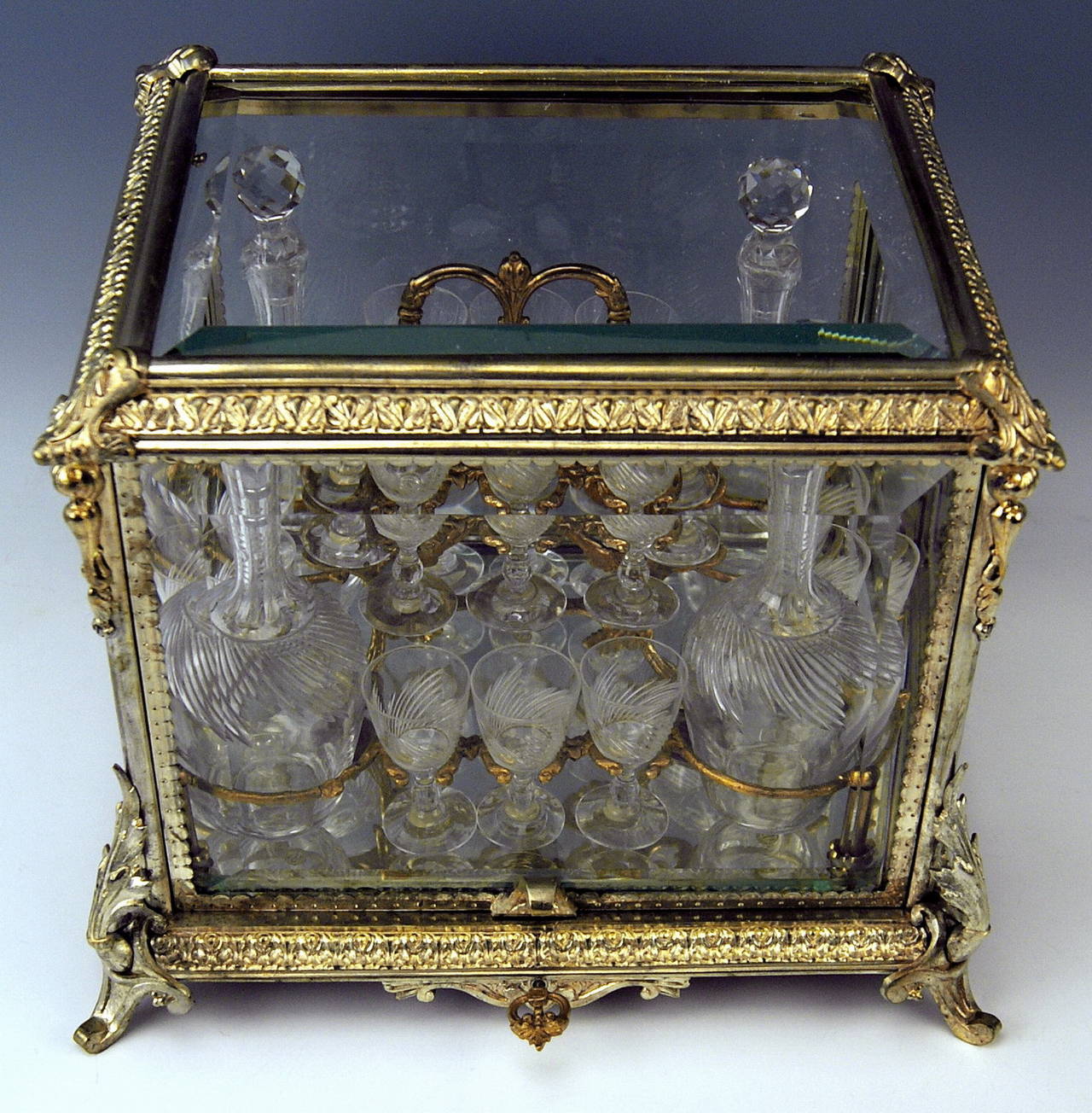 Gorgeous liqueur set in glass casket (= completely furnished) | made by Baccarat (France / Lorraine), circa 1900.

Manufactory Baccarat / France (Lorraine):
It is one of most famous glass manufactories of world, producing finest crystal glass