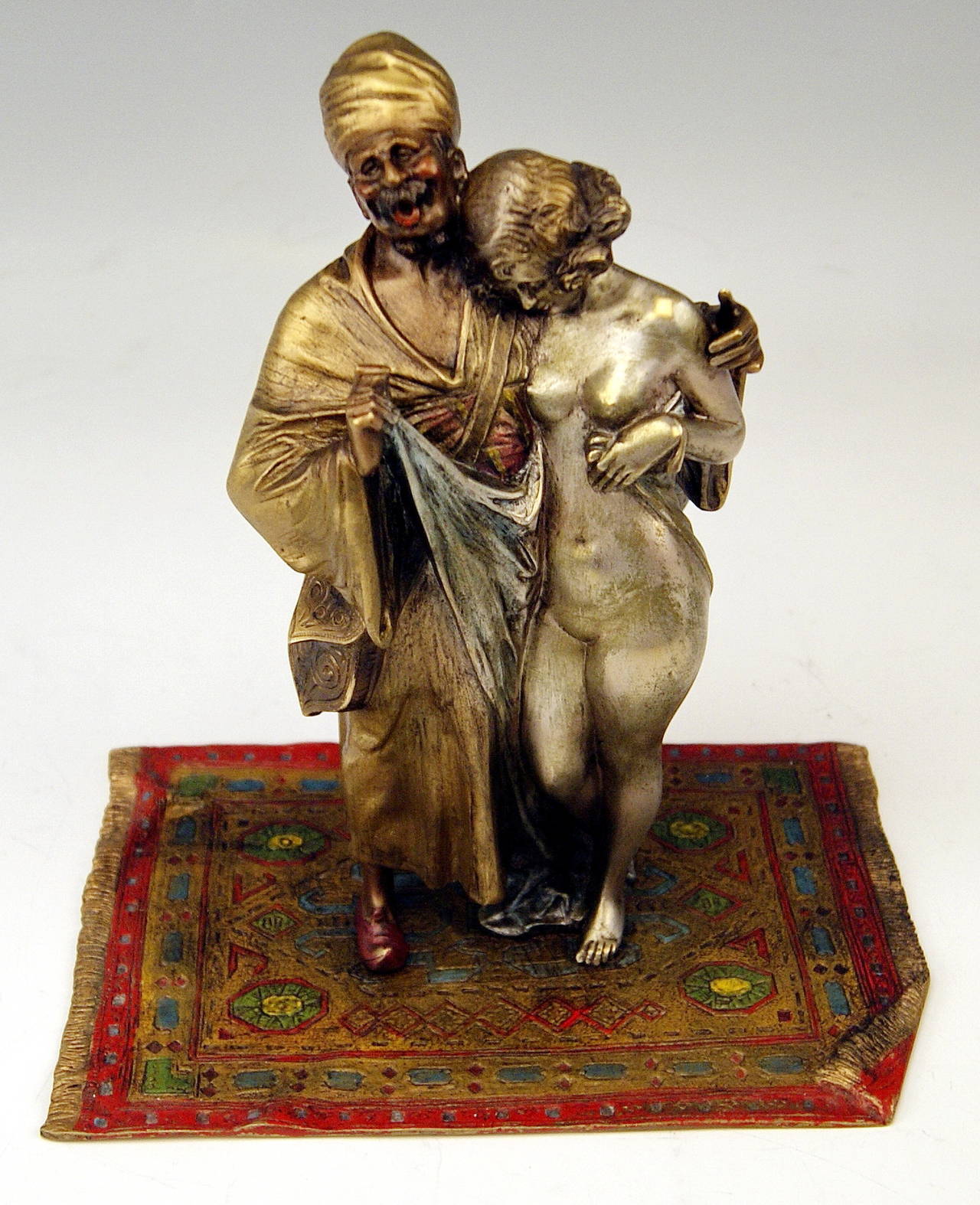 STUNNING BRONZE FIGURINE GROUP:
A SLAVE TRADER WITH GIRL (FEMALE NUDE).

ORIGIN OF MANUFACTORY:  VIENNA BRONZE

This REMARKABLE AS WELL AS STUNNING BRONZE FIGURINE GROUP is a FINEST EXAMPLE of VIENNESE BRONZE MANUFACTURING ! 

DATING:   