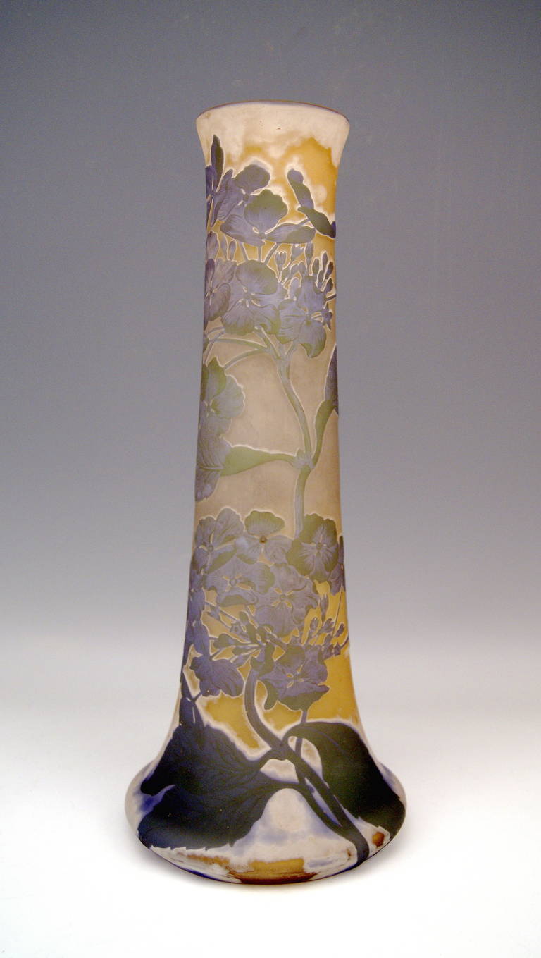 Gallé Nancy Art Nouveau Stalky Tall Vase made in France. 
Nancy, Lorraine made circa 1910. 
A gorgeous as well as phenomenal tall glass vase. Excellent casing glass  (orange, white, and bright violet shaded) with superb etched and cut ornaments: 