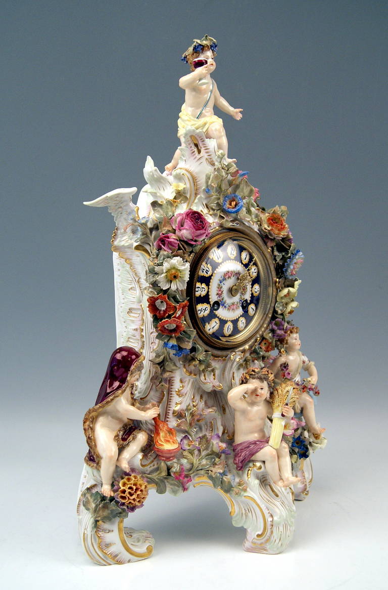 MEISSEN GORGEOUS MANTLE / TABLE CLOCK
decorated with STUNNING FIGURINES depicting THE FOUR SEASONS =
the FOUR SEASONS' FIGURINES are based on a KAENDLER MODEL

MANUFACTORY:  MEISSEN
DATING:        19TH CENTURY   /   MADE CIRCA 1860
MATERIAL:  