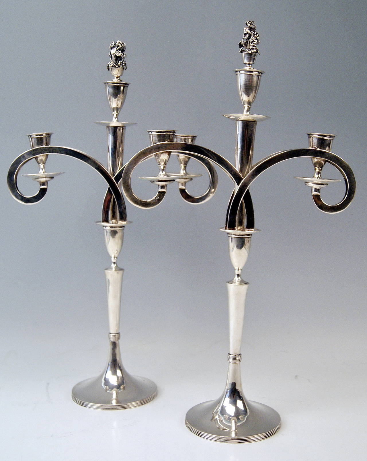 Gorgeous Viennese silver pair of tall candlesticks of finest manufacturing quality as well as of most elegant appearance.
These candlesticks were made during Viennese Empire period, circa 1790-1814. They are stunningly made in following