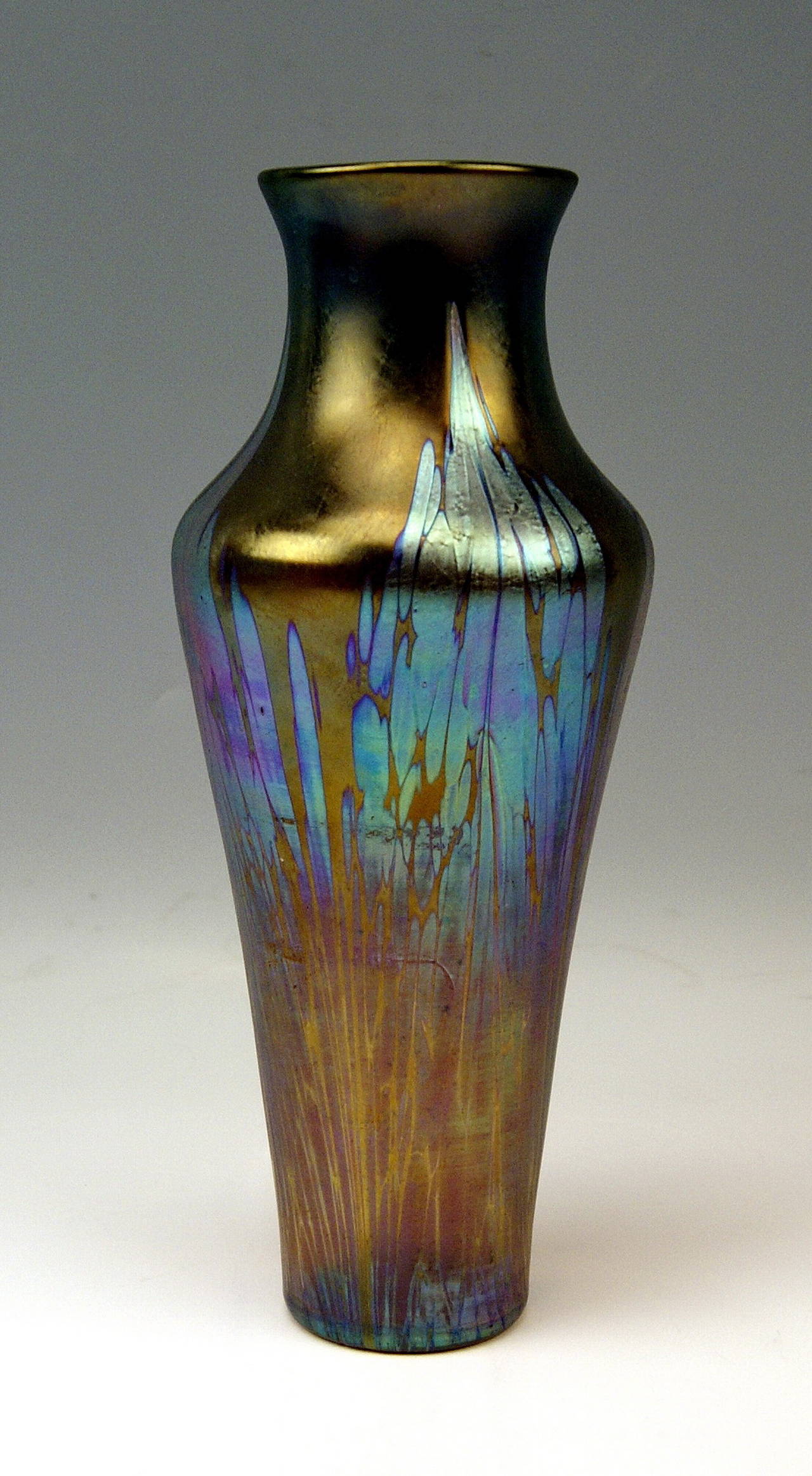 Gorgeous Vase Loetz Widow Art Nouveau 

Made by Loetz, Klostermuehle   circa  1900 / 05
Decor:   Phaenomen Gre 2/484 Medici / Glass shaded in Spreading Chestnut Brown

This finest Loetz Art Nouveau Vase is of oblong as well as of tapering form