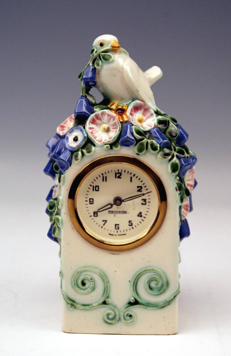 Most lovely table clock with bird  circa 1913-15
 Modelled by   michael powolny   (1871 - 1954)    /   circa 1907

 Hallmarked:
 Manufactured by  wiener keramik and gmundner keramik  
 (union of vienna ceramics & gmunden ceramics   / 