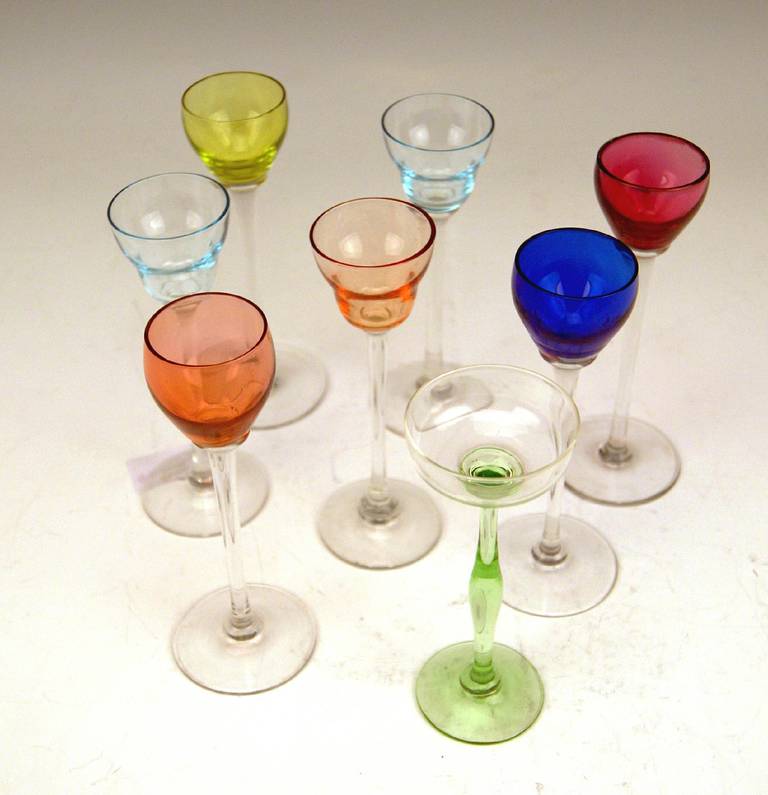 Most elegant Art Nouveau Set of Eight Stalky Liqueur Glasses designed by Kolo Moser   /   the stalks are made of colorless glass  /  the cups of glasses are shaded in various colors   (for example made of rose-red, violet, royal blue, pastel green,